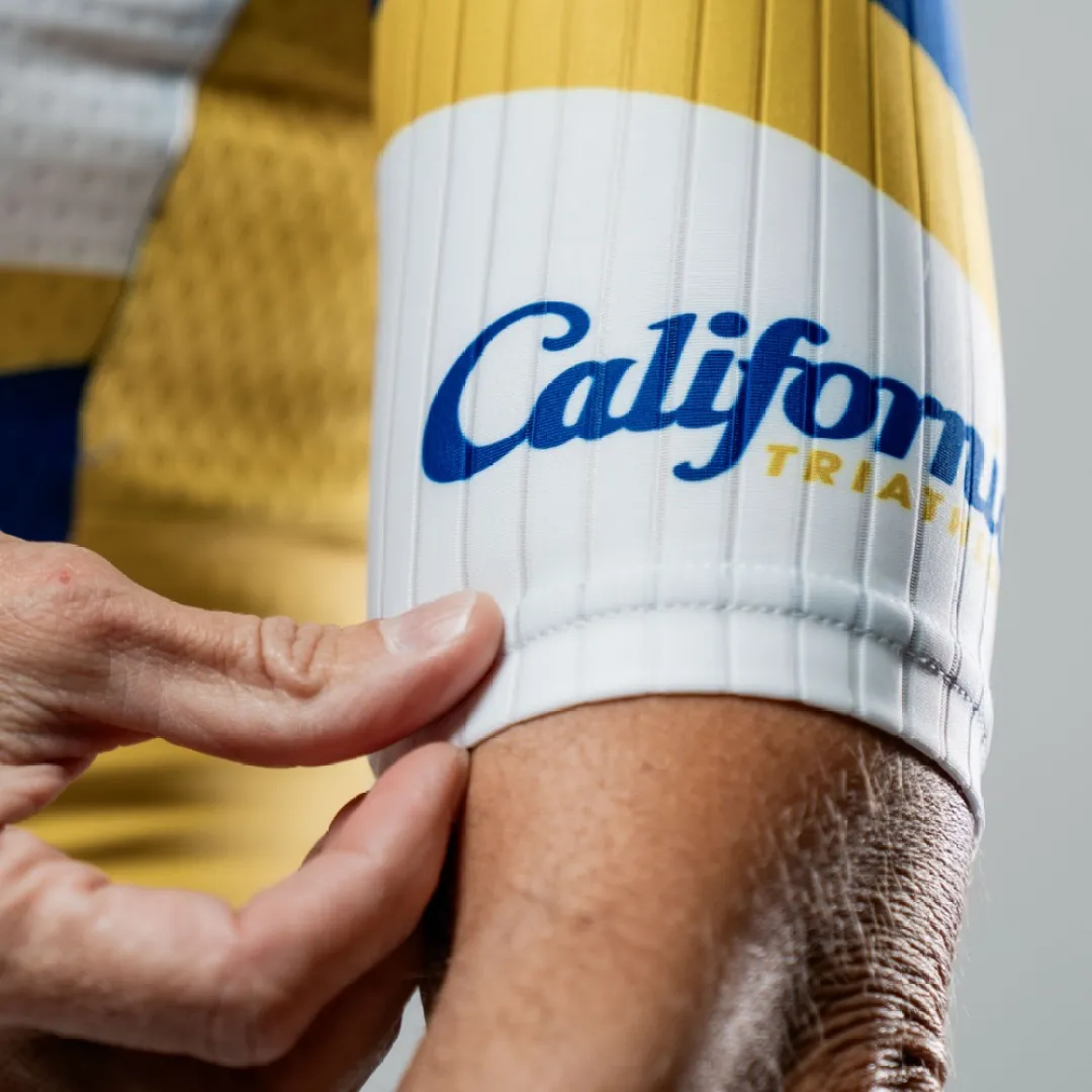 Close-up detail of the Cal Tri kit sleeve and branding.